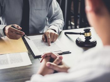 businessman-and-male-lawyer-or-judge-consult-having-team-meeting-with-client-law-and-legal-services-concept